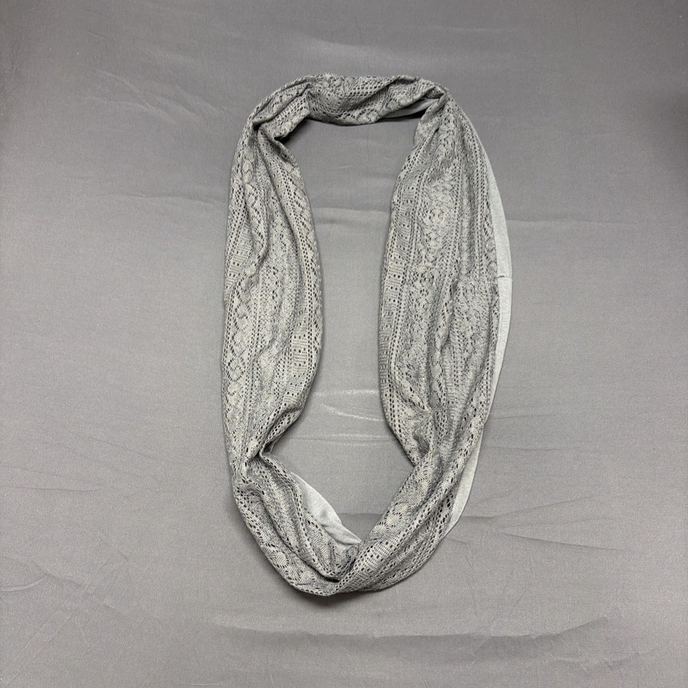 light gray infinity scarf featuring a delicate lace-like pointelle pattern